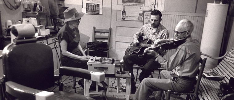 Mary Celestia Parler recording Fred C. Smith and an unidentified musician in Oriole Barber Shop, Bentonville, Arkansas, ca. 1950 - Ozark Folksong Collection